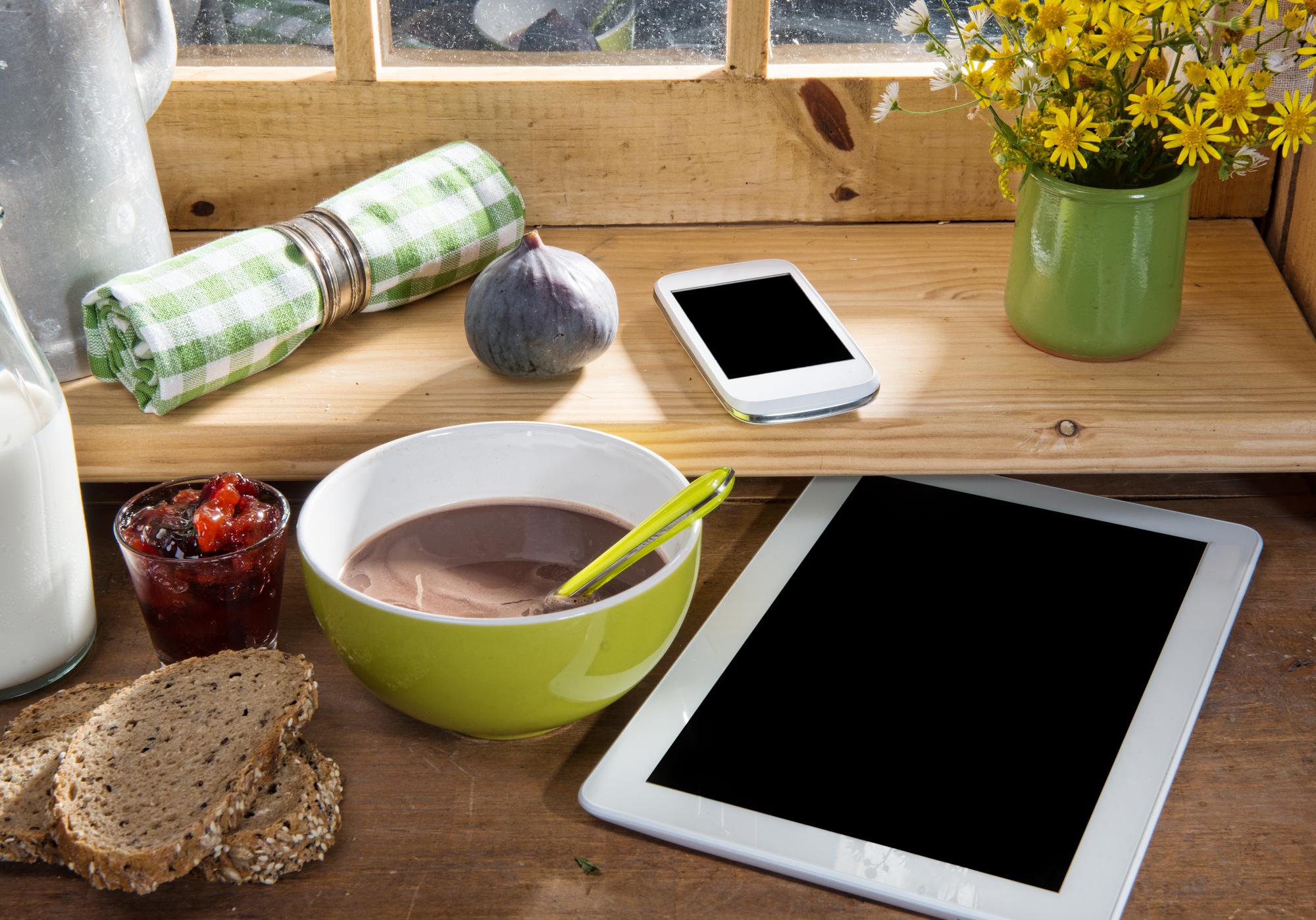 Home kitchen workspace with ingredients and tablet showing recipe